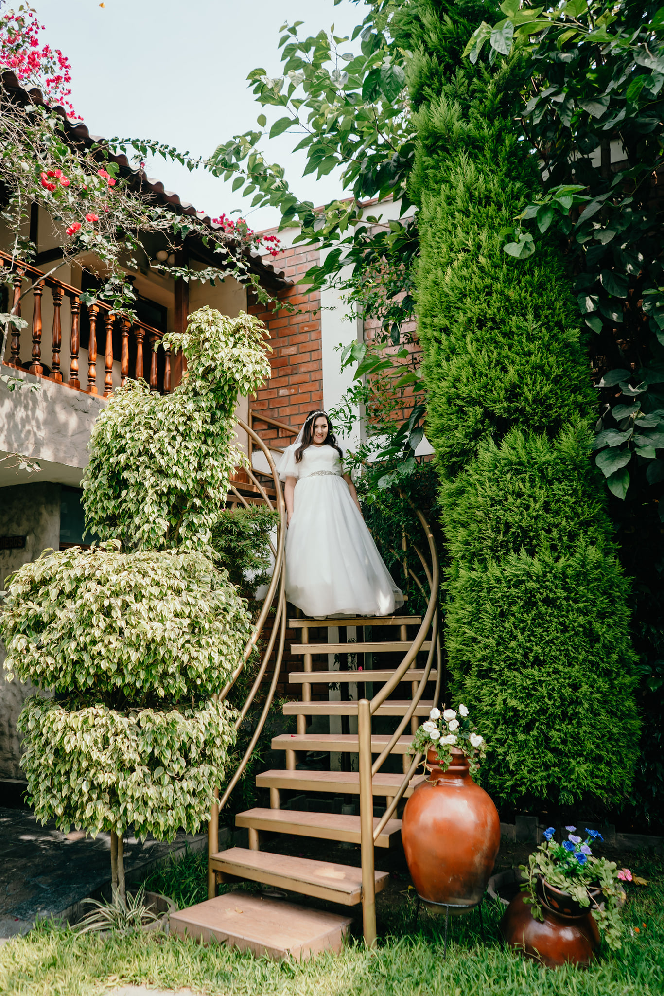 Bride walking down stairs.